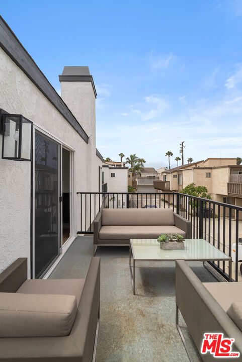 213 17th Street, Unit A Huntington Beach, CA 92648 - Photo 2 of 31 a view of balcony with furniture