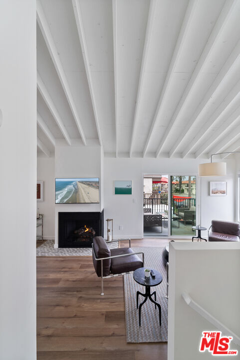213 17th Street, Unit A Huntington Beach, CA 92648 - Photo 21 of 31 a living room with furniture and a fireplace
