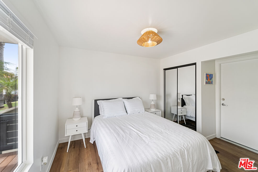 213 17th Street, Unit A Huntington Beach, CA 92648 - Photo 10 of 31 a bedroom with a bed and a window