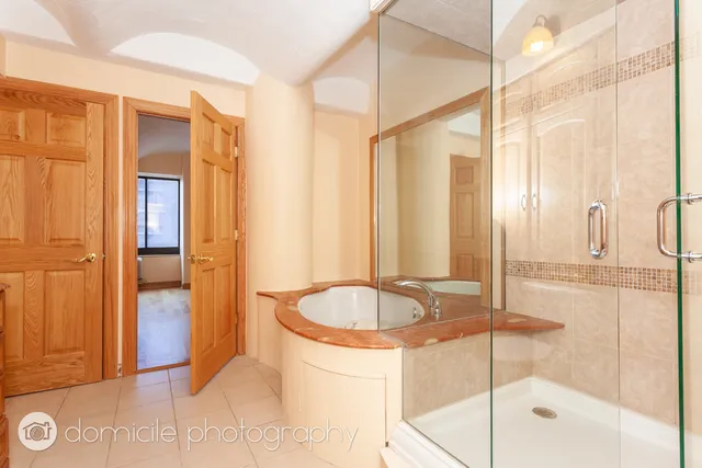 a bathroom with a tub and shower