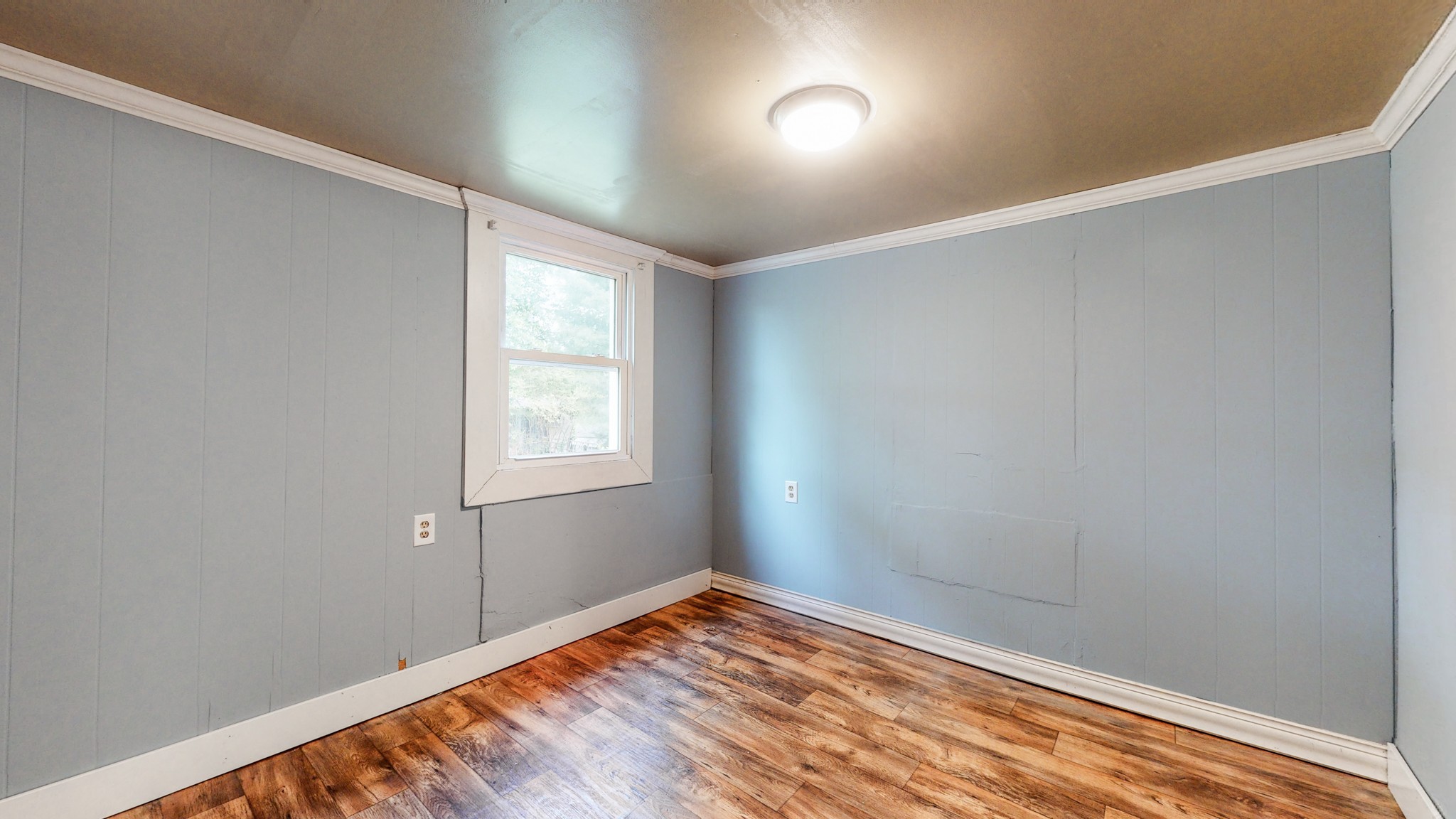 2977 Old Stewart Road Tennessee Ridge, TN 37178 - Photo 22 of 40 a view of empty room with wooden floor and fan