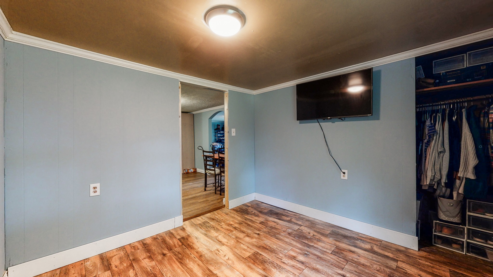 2977 Old Stewart Road Tennessee Ridge, TN 37178 - Photo 24 of 40 a view of a livingroom with wooden floor and a flat screen tv