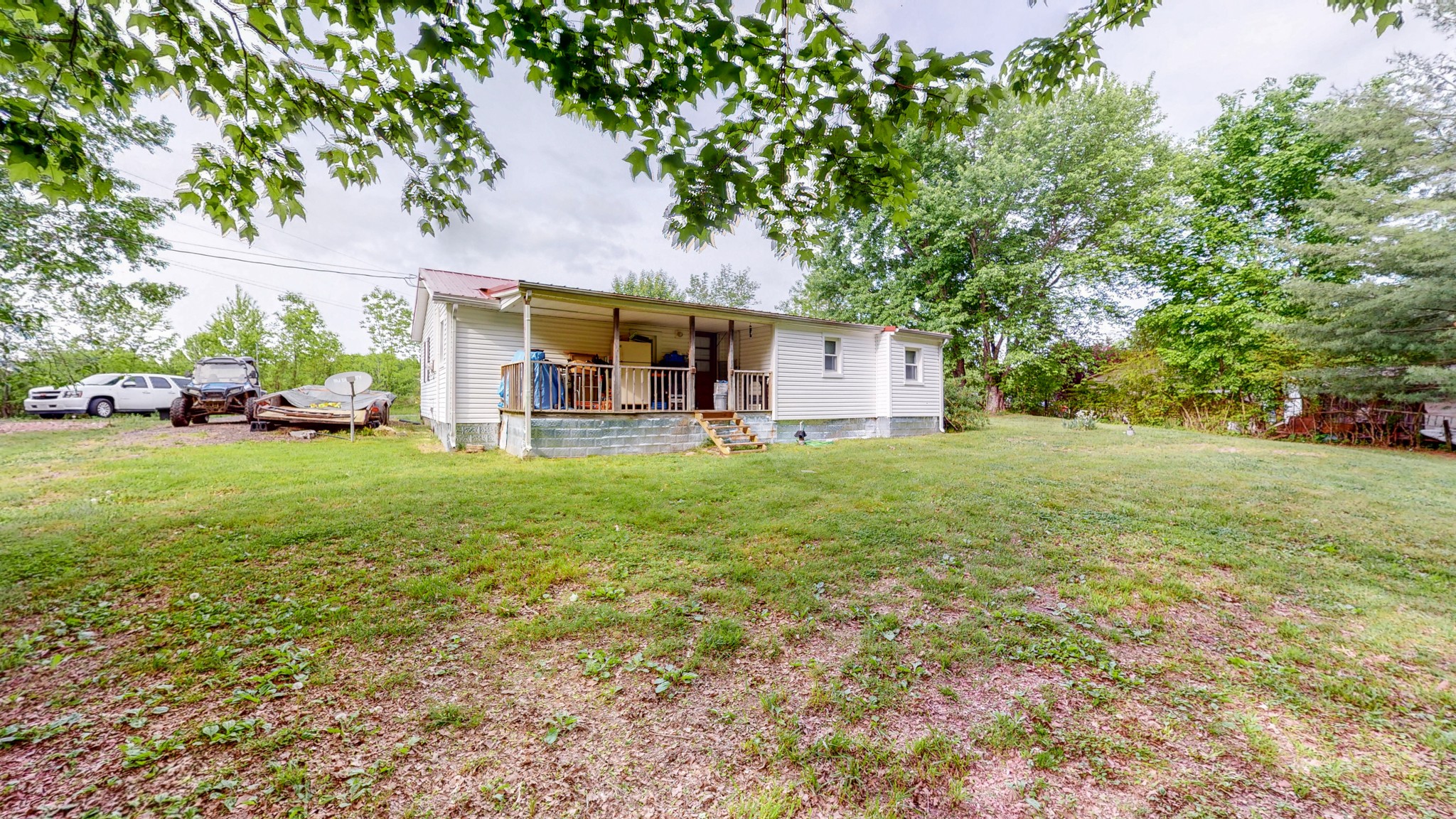 2977 Old Stewart Road Tennessee Ridge, TN 37178 - Photo 35 of 40 a view of a house with a yard and sitting area