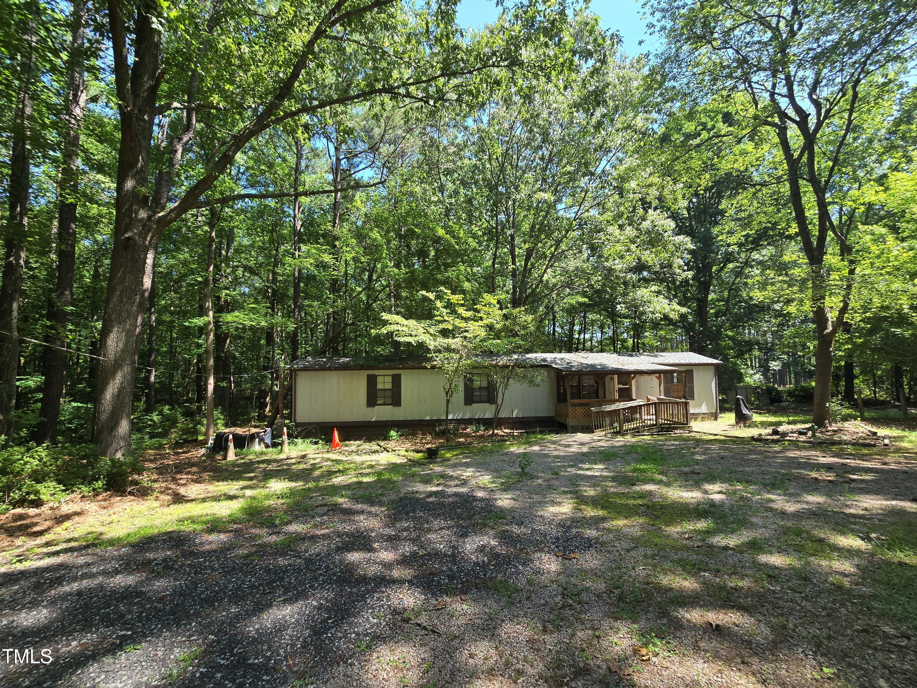 1337 Carroll Heights Road Zebulon, NC 27597 - Photo 1 of 9 a view of a house with a yard