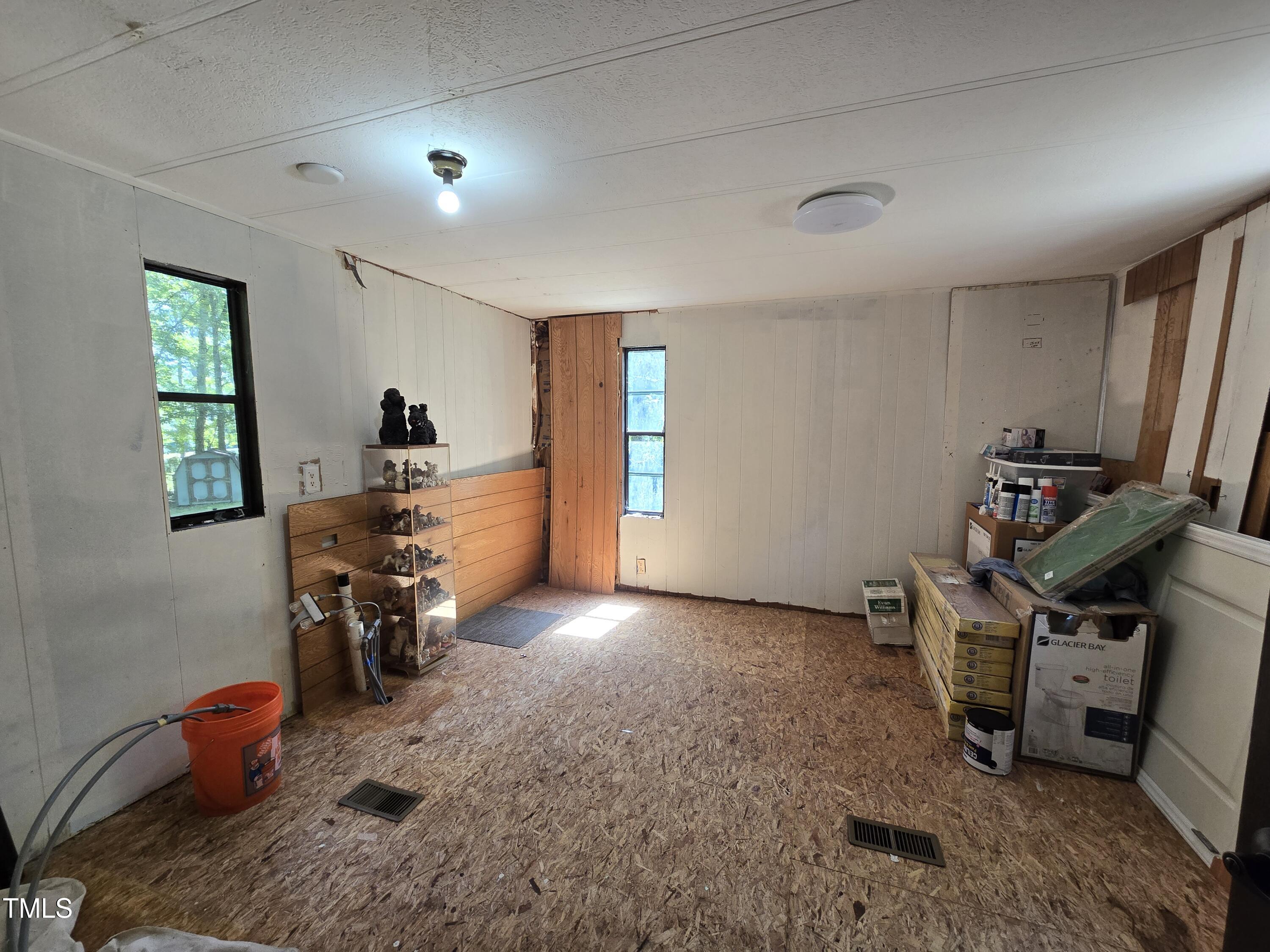 1337 Carroll Heights Road Zebulon, NC 27597 - Photo 7 of 9 a view of a room with furniture and toys