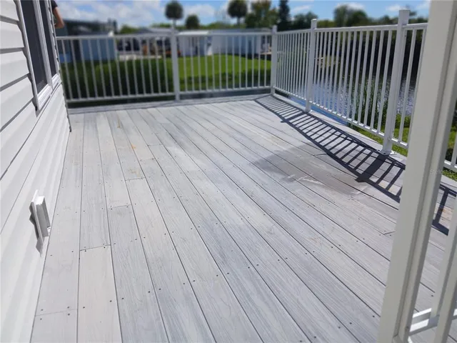 a view of deck with wooden floor and fence