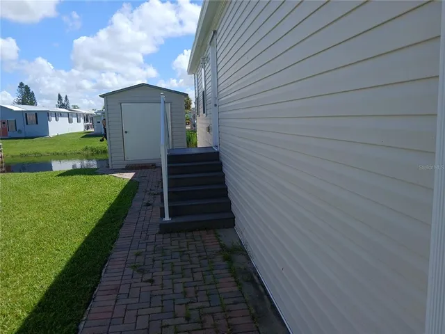 a view of a backyard with pathway