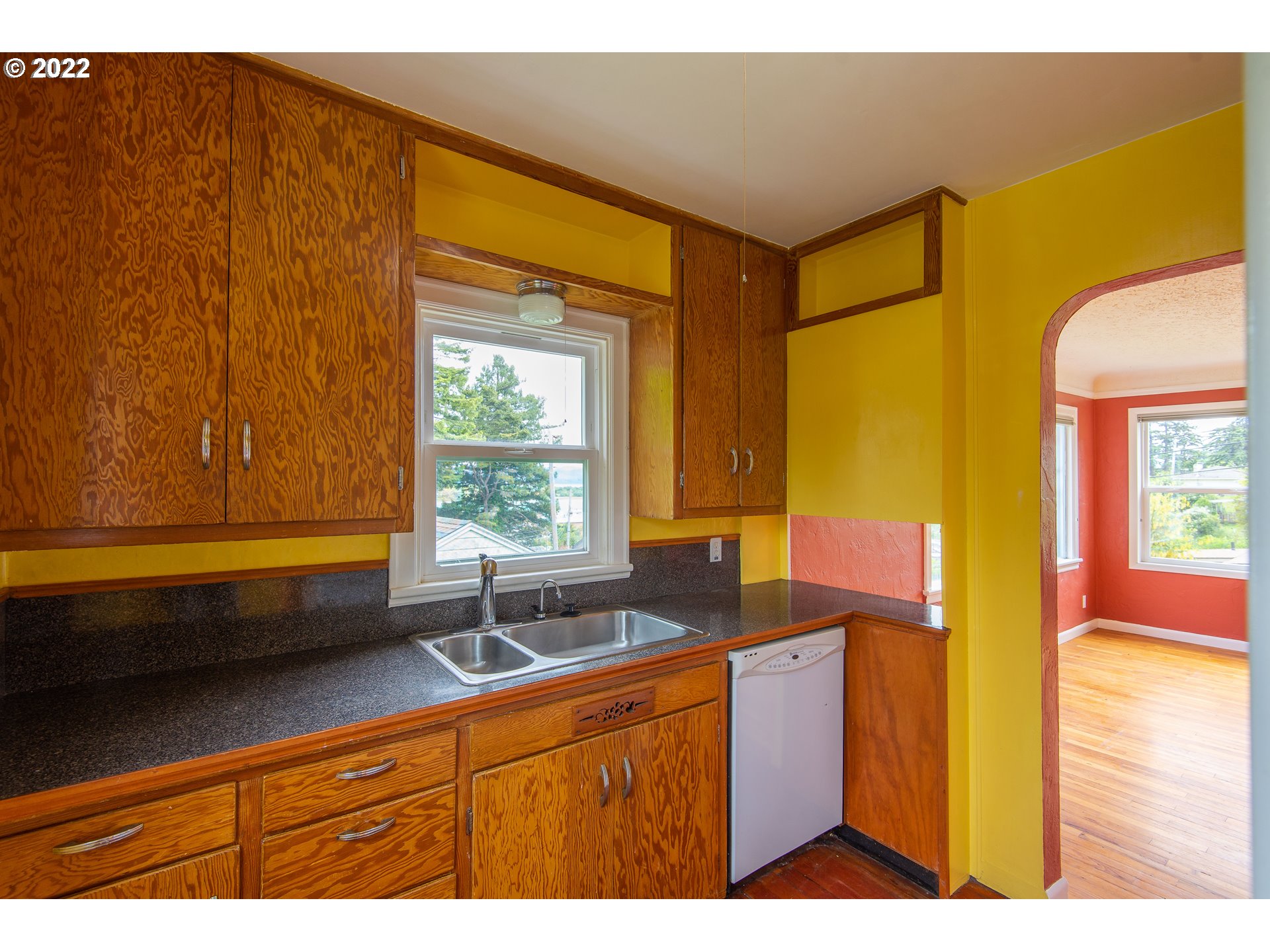 544 Clark Street North Bend, OR 97459 - Photo 11 of 32 a kitchen that has a sink and a window