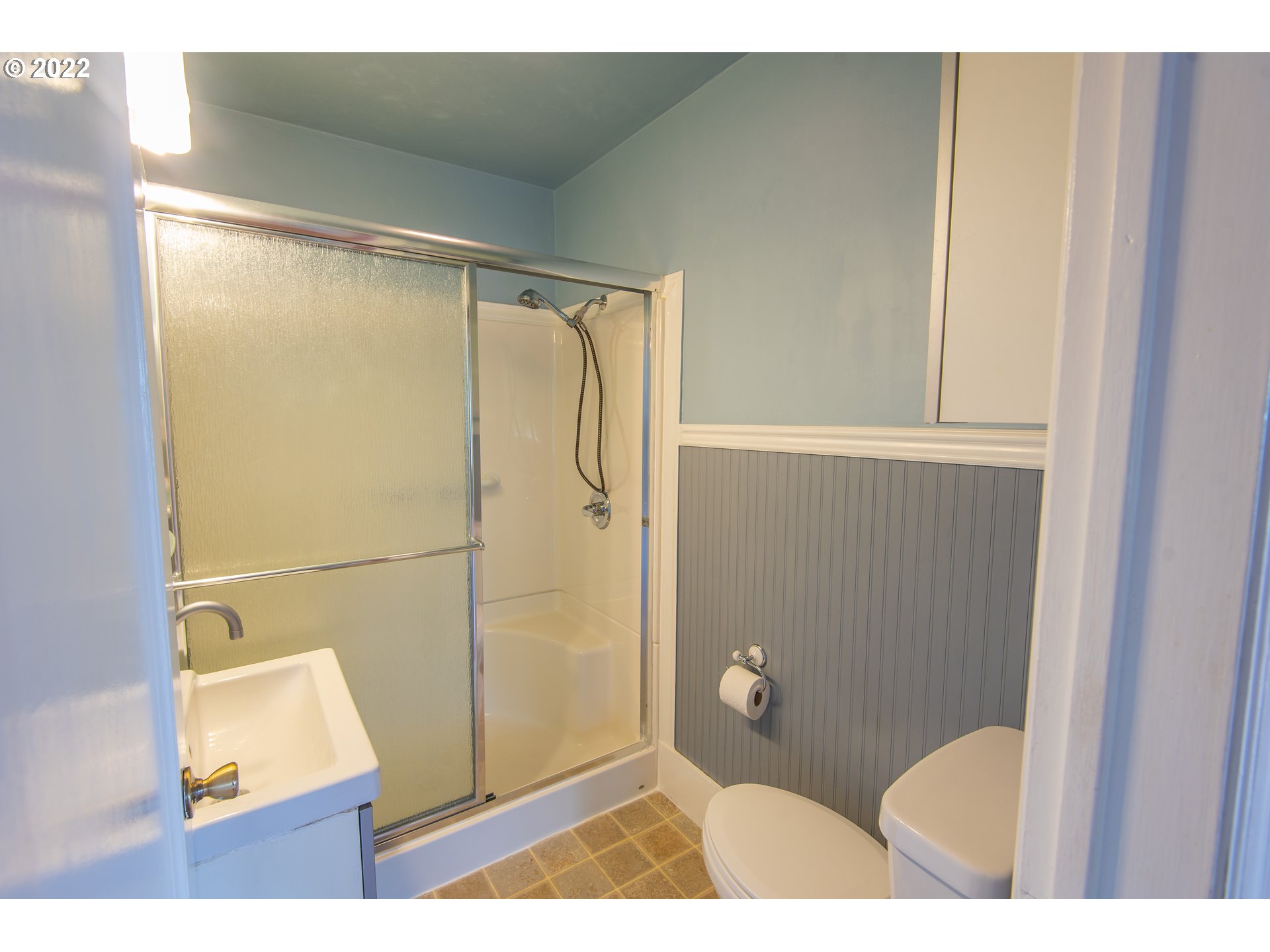 544 Clark Street North Bend, OR 97459 - Photo 17 of 32 a bathroom with a shower and a toilet
