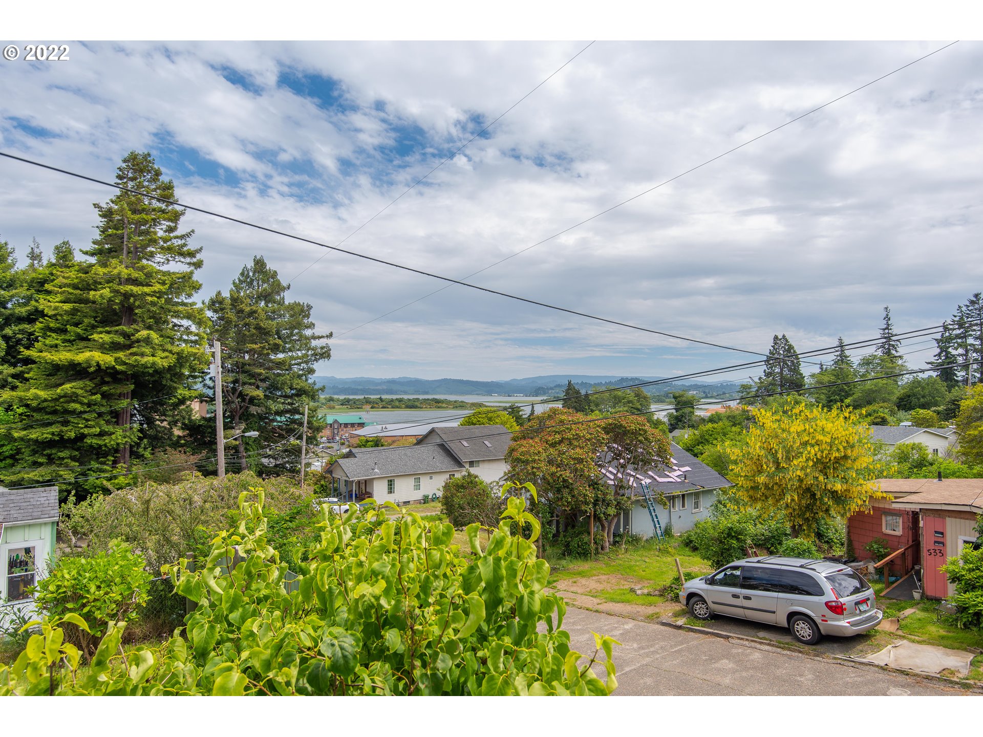 544 Clark Street North Bend, OR 97459 - Photo 2 of 32 a view of yard with car parked