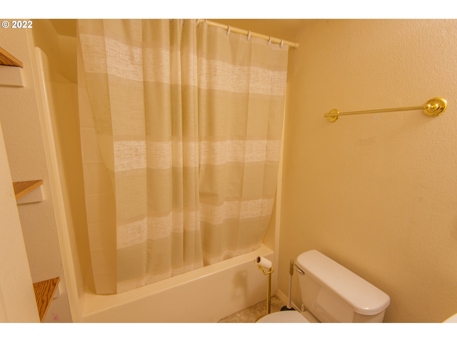 544 Clark Street North Bend, OR 97459 - Photo 26 of 32 a bathroom with a shower curtain