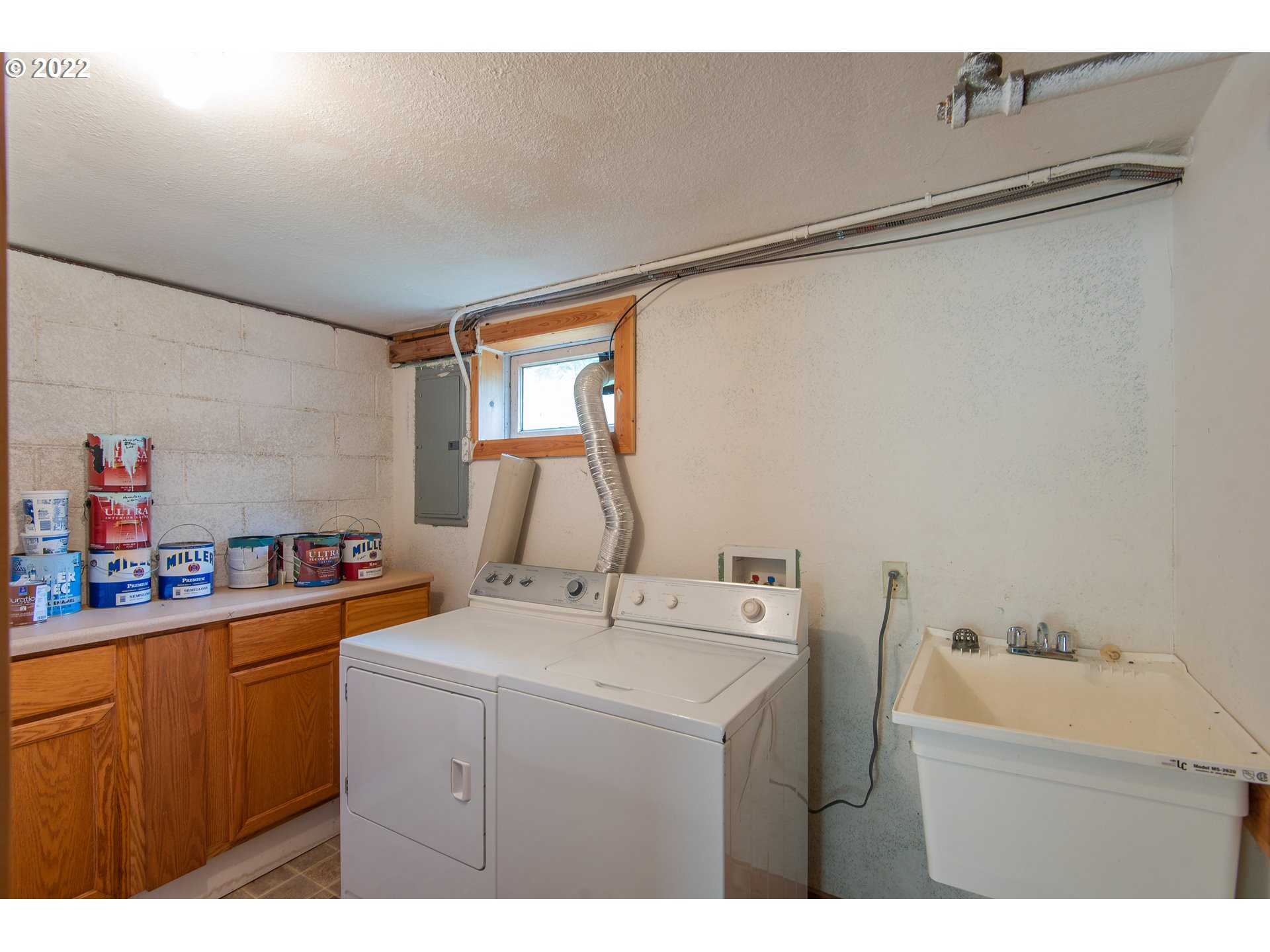 544 Clark Street North Bend, OR 97459 - Photo 29 of 32 a kitchen with a sink cabinets and appliances