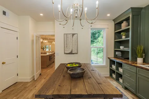 a work room with furniture and a window
