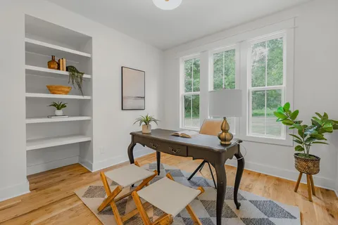 a view of a workspace with furniture