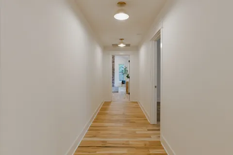 a spacious bedroom with a bed and a large window
