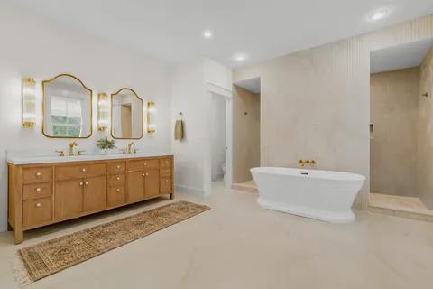 a white toilet sitting next to a white wall