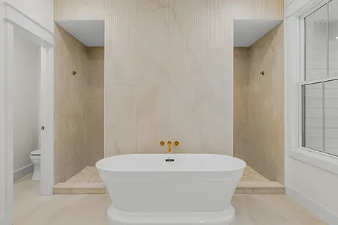 a view of gallery with wooden floor