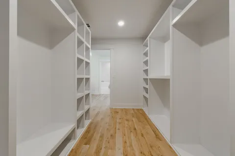 a bathroom with a sink mirror vanity and toilet