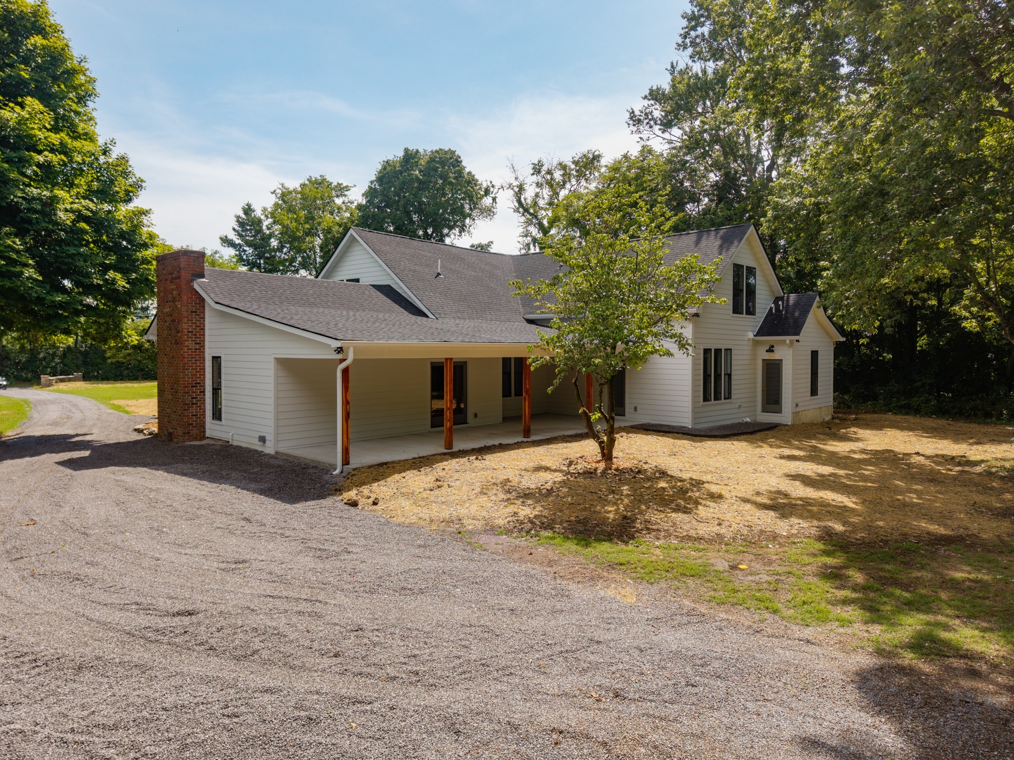 1629 Cairo Road Gallatin, TN 37066 - Photo 56 of 60 a front view of a house with a yard and garage
