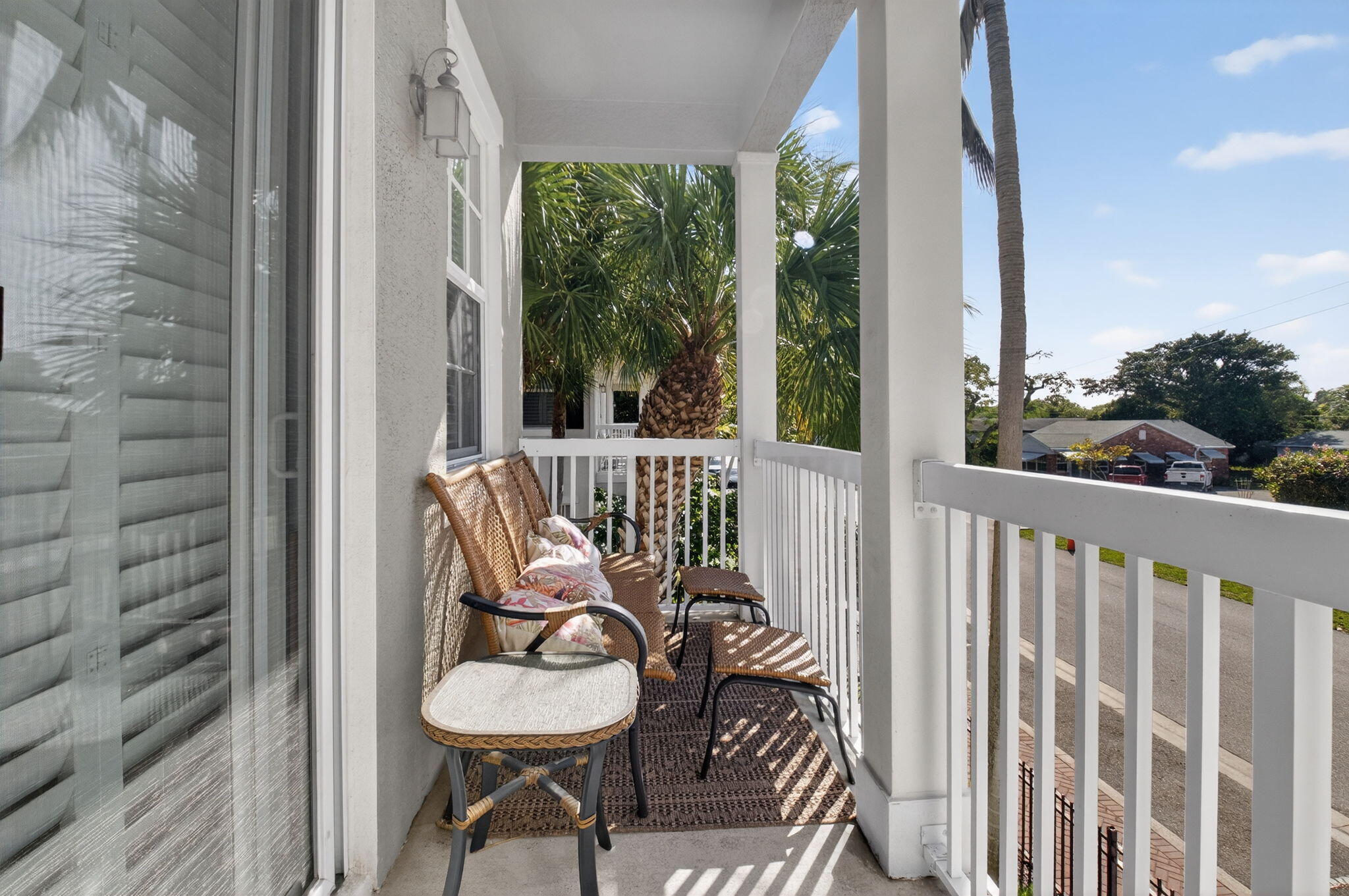 119 Southwest 2nd Avenue Delray Beach, FL 33444 - Photo 28 of 63 a view of a chair and tables in the balcony