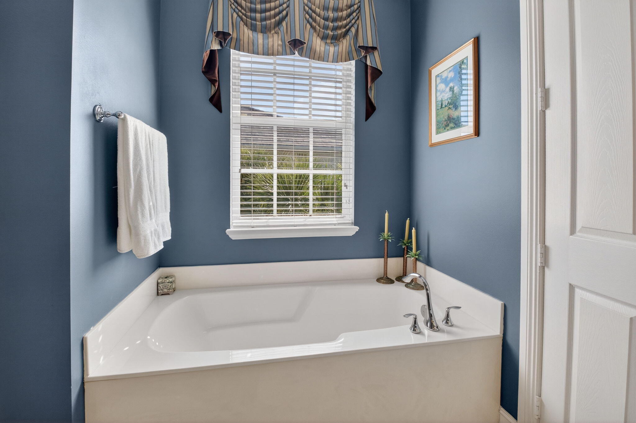 119 Southwest 2nd Avenue Delray Beach, FL 33444 - Photo 37 of 63 a white bath tub sitting next to a window