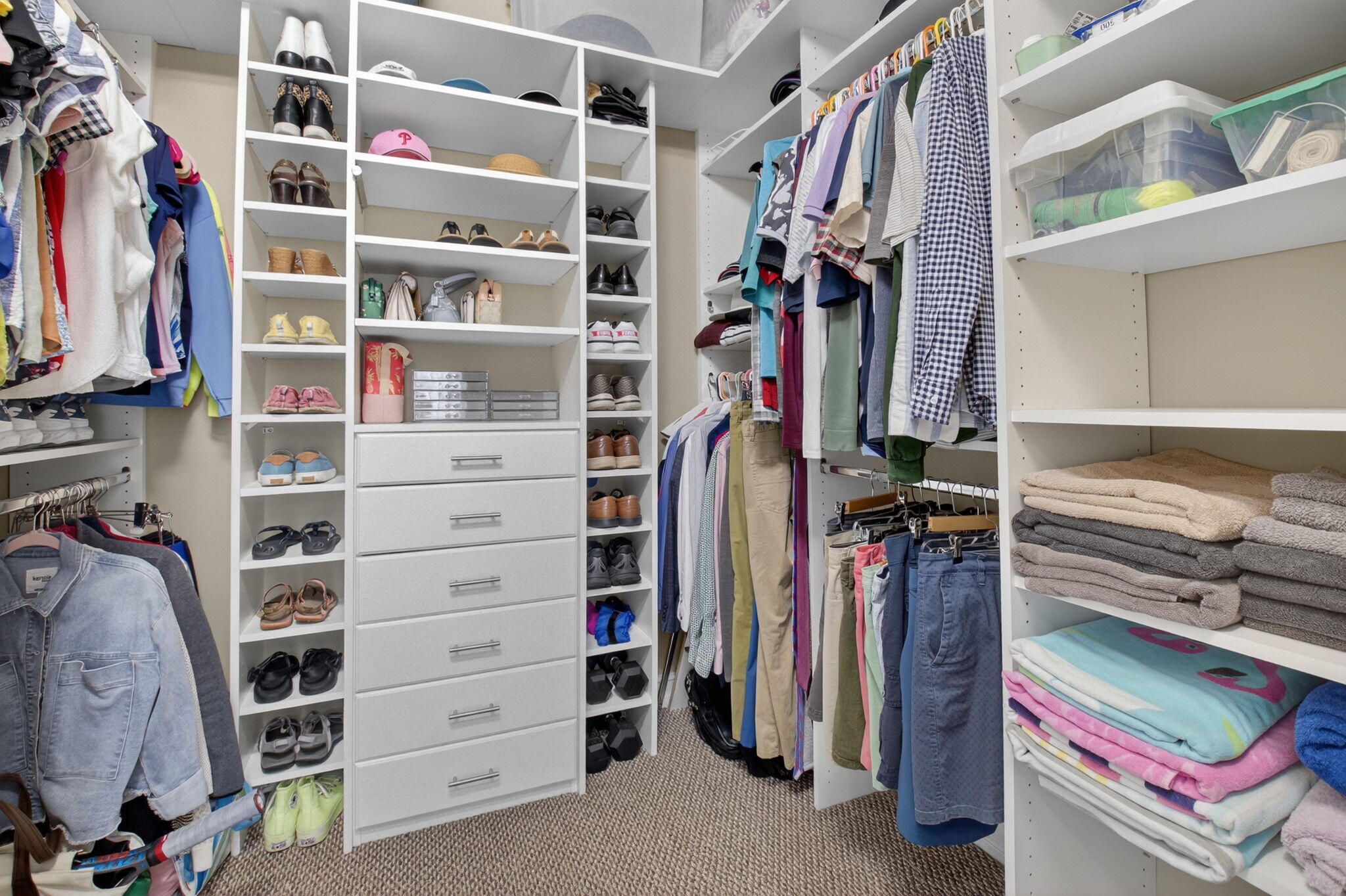 119 Southwest 2nd Avenue Delray Beach, FL 33444 - Photo 40 of 63 a view of walk in closet with clothes and shoes
