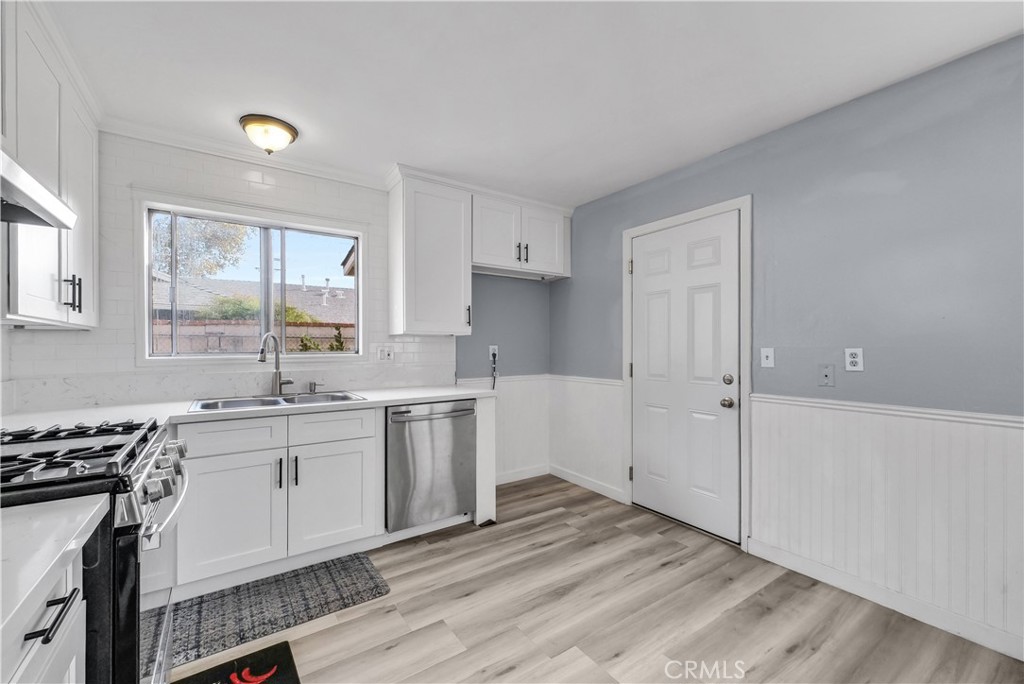 8682 La Grande Street Rancho Cucamonga, CA 91701 - Photo 11 of 29 a kitchen with a sink stove and cabinets