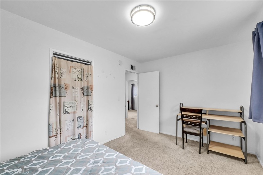 8682 La Grande Street Rancho Cucamonga, CA 91701 - Photo 17 of 29 a bedroom with a bed and a window