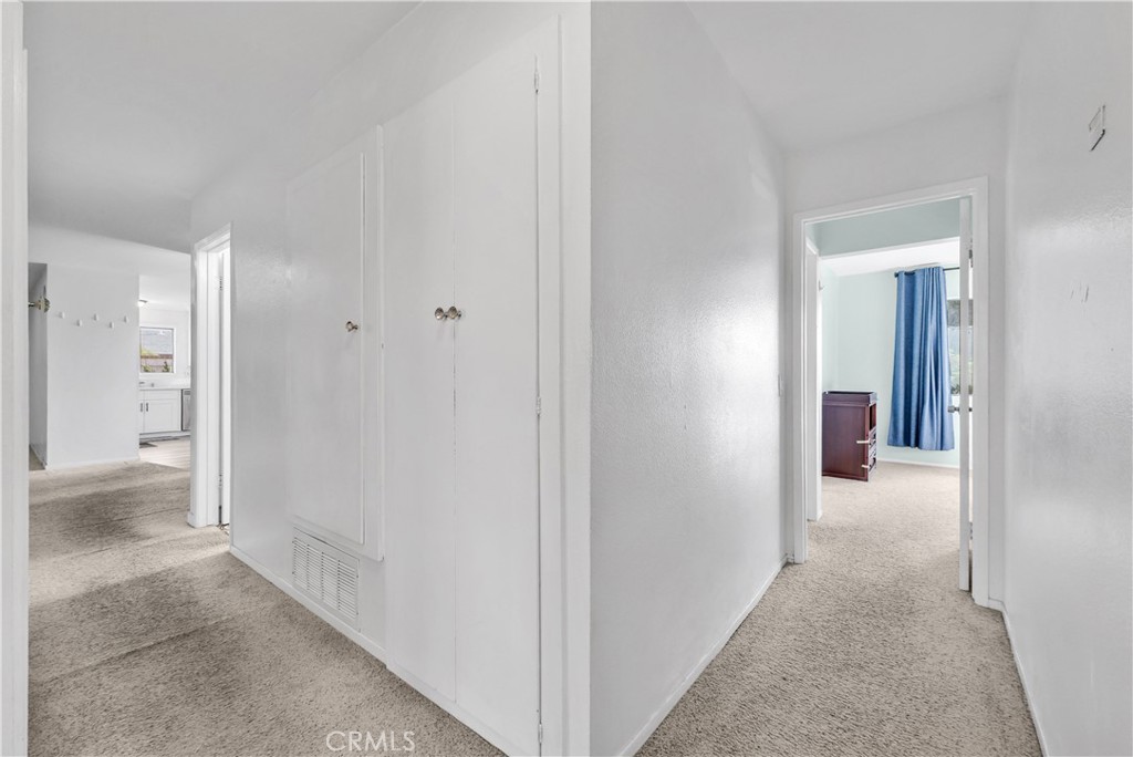8682 La Grande Street Rancho Cucamonga, CA 91701 - Photo 24 of 29 a view of a hallway with wooden shelves