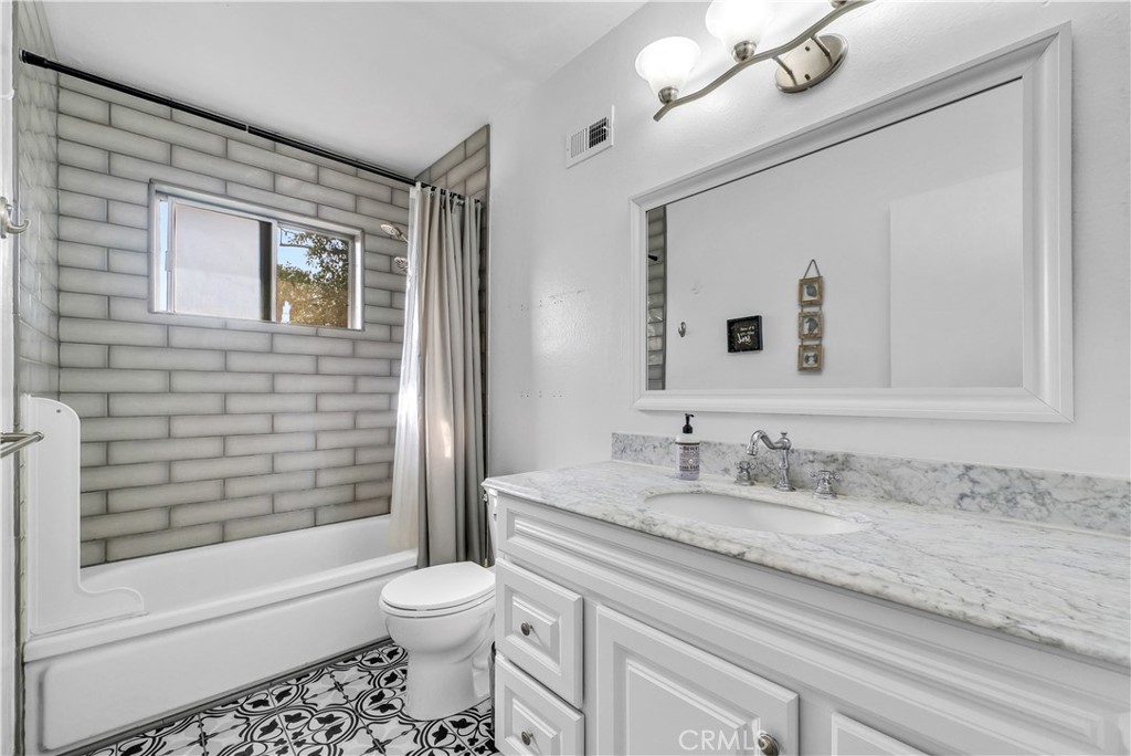 8682 La Grande Street Rancho Cucamonga, CA 91701 - Photo 25 of 29 a bathroom with a sink a toilet and shower