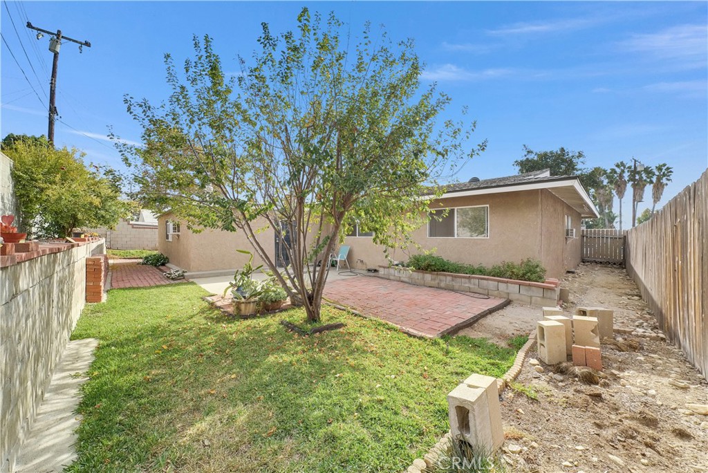 8682 La Grande Street Rancho Cucamonga, CA 91701 - Photo 28 of 29 a backyard of a house with table and chairs