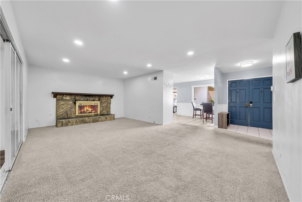 8682 La Grande Street Rancho Cucamonga, CA 91701 - Photo 5 of 29 a view of a hallway with wooden shelves
