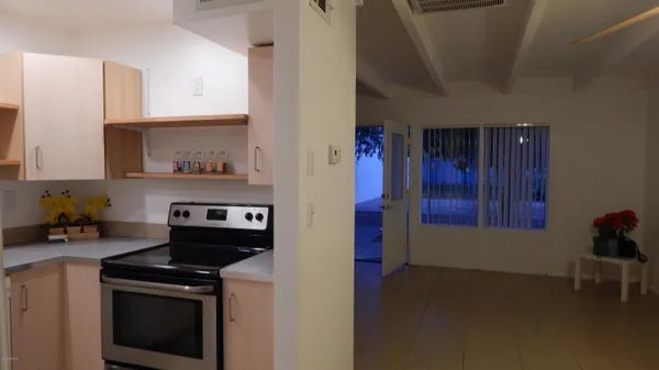 a kitchen with stainless steel appliances granite countertop a stove and a microwave