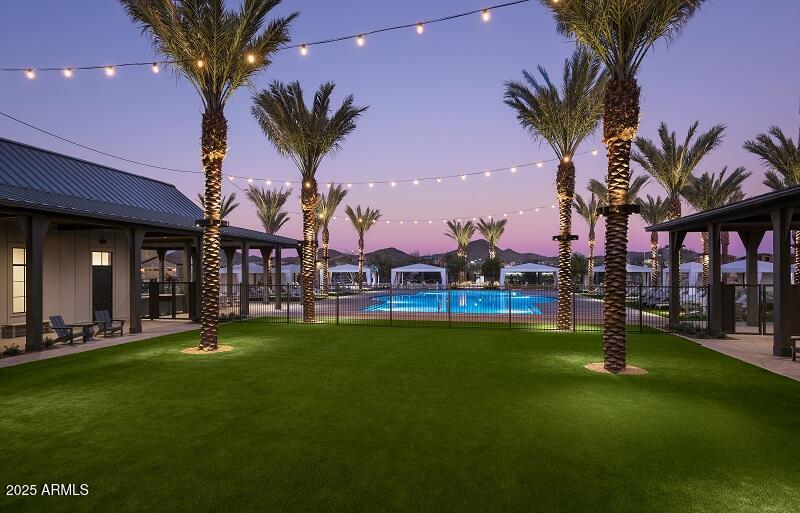 2232 West Chisum Trail Phoenix, AZ 85085 - Photo 12 of 75 a view of a swimming pool with a table and chairs