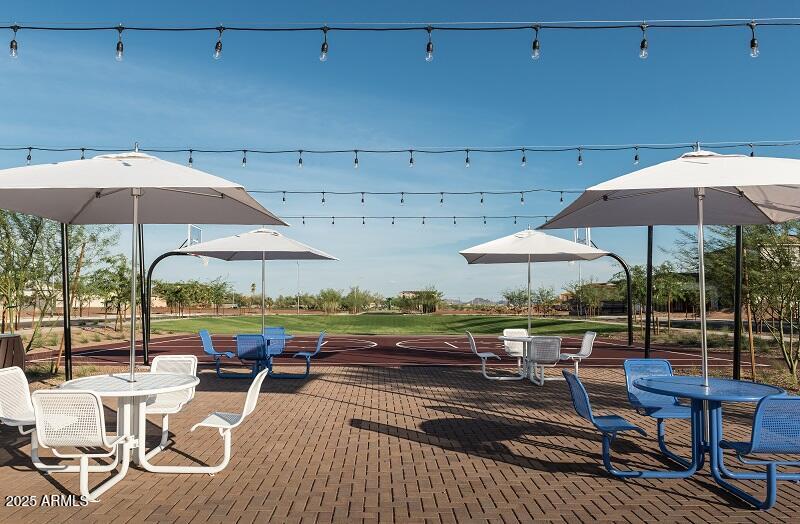 2232 West Chisum Trail Phoenix, AZ 85085 - Photo 65 of 75 a view of patio with chairs and table under an umbrella