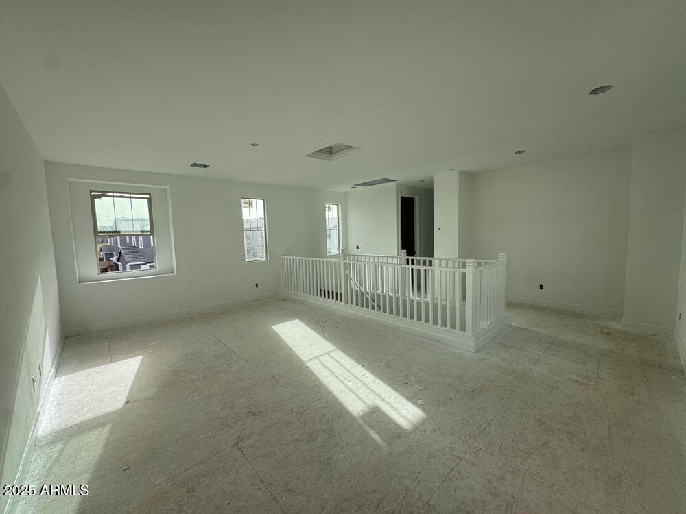 2232 West Chisum Trail Phoenix, AZ 85085 - Photo 8 of 75 a view of a hallway with windows