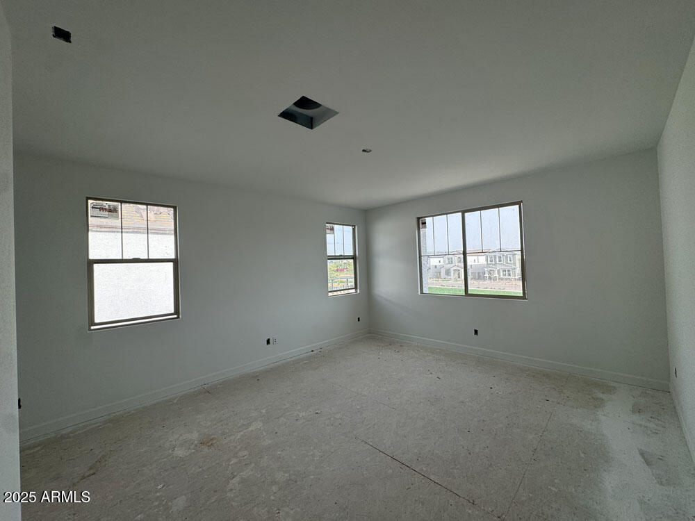 2232 West Chisum Trail Phoenix, AZ 85085 - Photo 9 of 75 a view of an empty room with a window