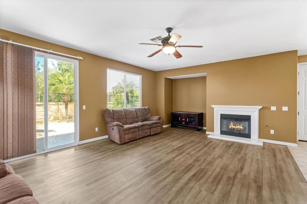 1049 Boulder Place Oceanside, CA 92057 - Photo 12 of 49 a living room with furniture and a fireplace