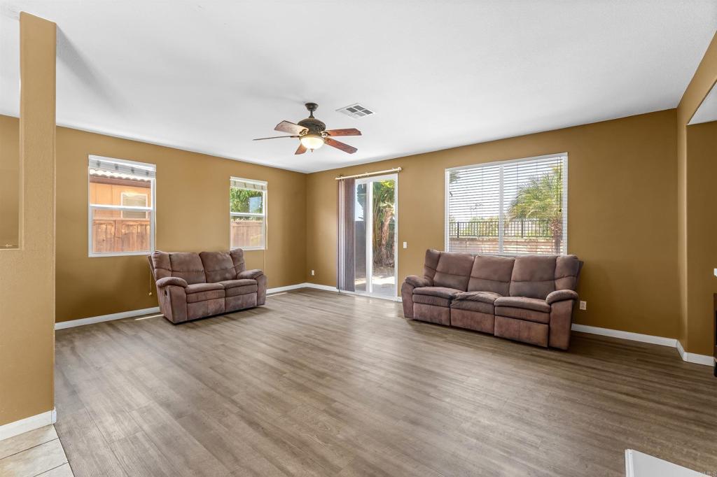 1049 Boulder Place Oceanside, CA 92057 - Photo 13 of 49 a living room with furniture and a large window