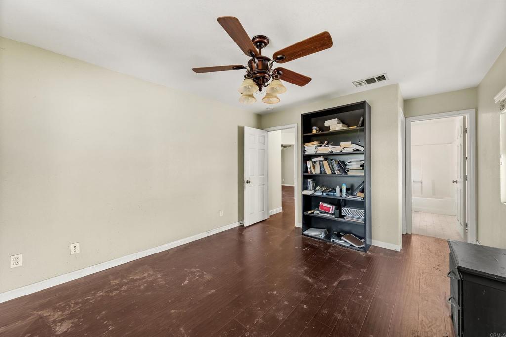 1049 Boulder Place Oceanside, CA 92057 - Photo 18 of 49 a view of a livingroom with a book shelf
