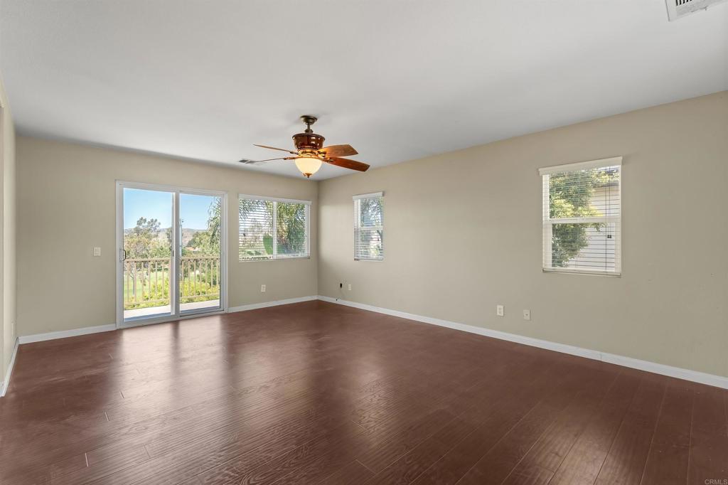 1049 Boulder Place Oceanside, CA 92057 - Photo 20 of 49 a view of an empty room with wooden floor and a window