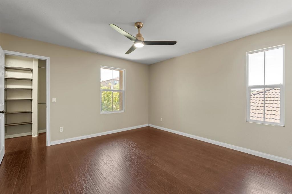 1049 Boulder Place Oceanside, CA 92057 - Photo 26 of 49 wooden floor in an empty room with a window