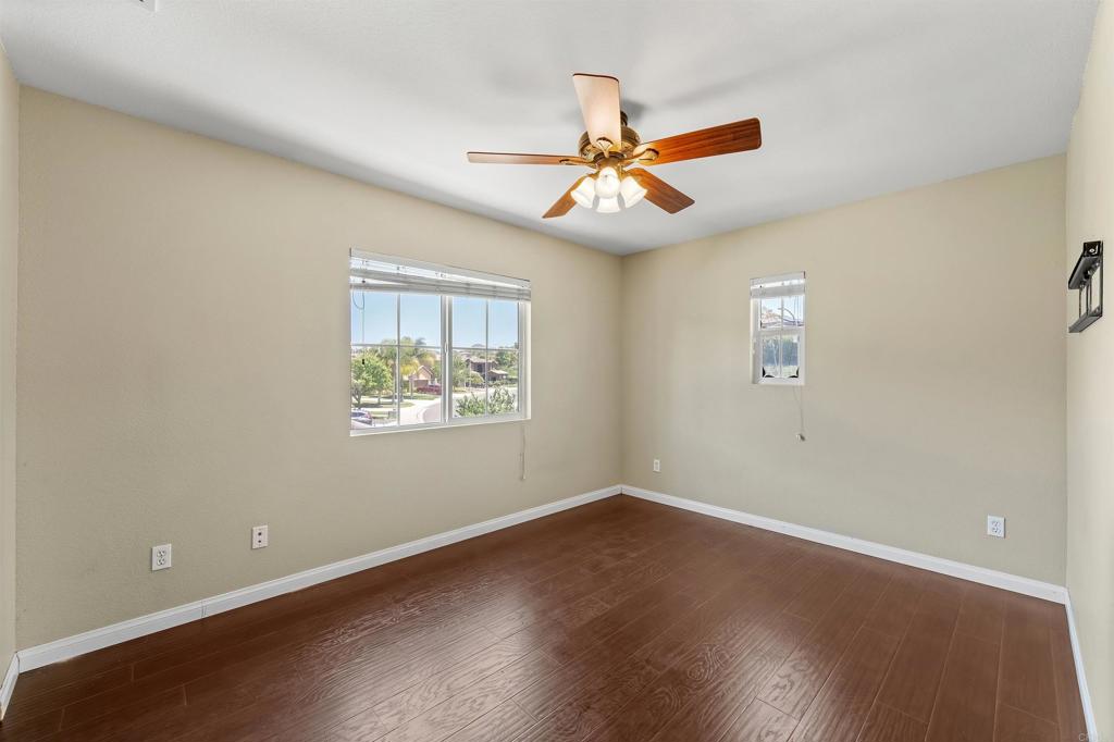 1049 Boulder Place Oceanside, CA 92057 - Photo 33 of 49 a view of an empty room with wooden floor and a window