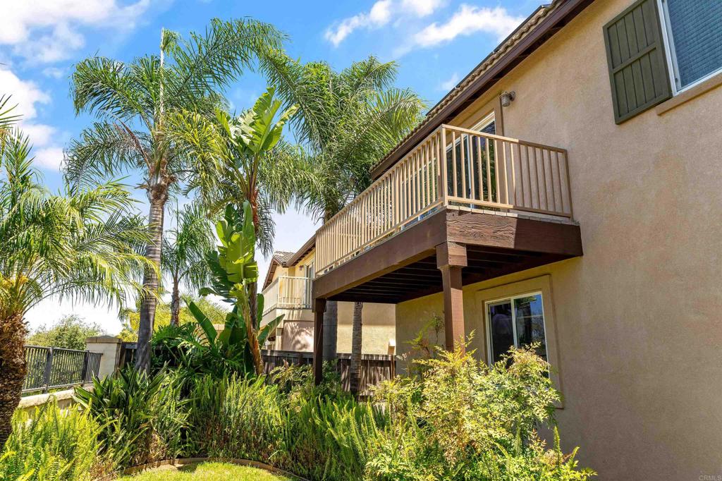 1049 Boulder Place Oceanside, CA 92057 - Photo 36 of 49 a front view of a house with a yard