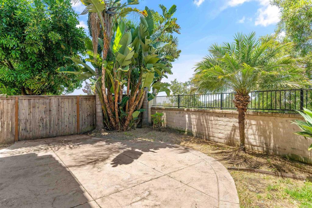 1049 Boulder Place Oceanside, CA 92057 - Photo 37 of 49 a front view of a house having yard