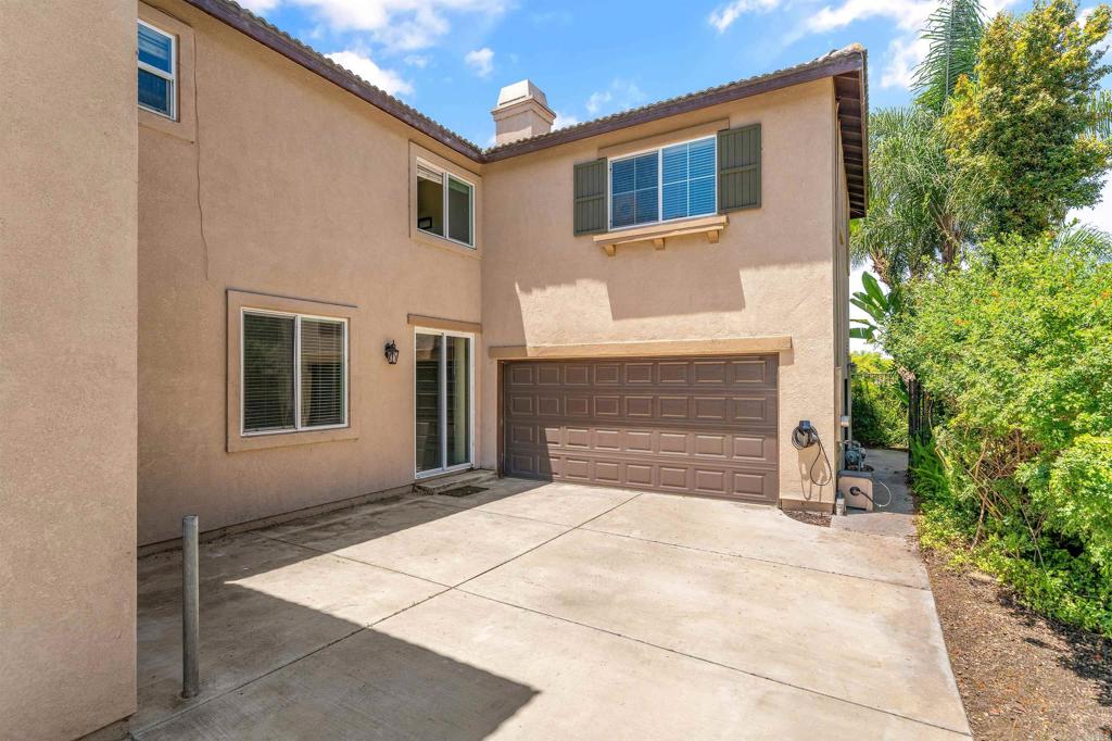 1049 Boulder Place Oceanside, CA 92057 - Photo 38 of 49 a front view of a house with a garage