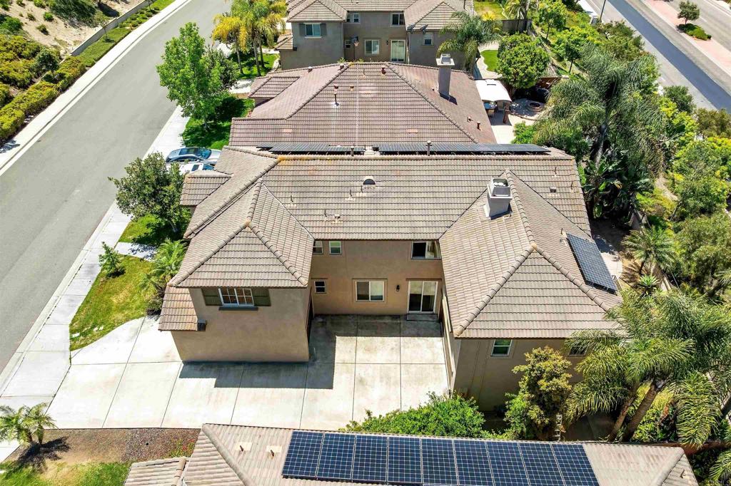 1049 Boulder Place Oceanside, CA 92057 - Photo 4 of 49 an aerial view of a house with a yard