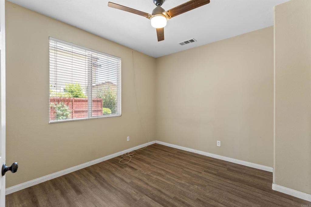 1049 Boulder Place Oceanside, CA 92057 - Photo 44 of 49 wooden floor in an empty room with a window