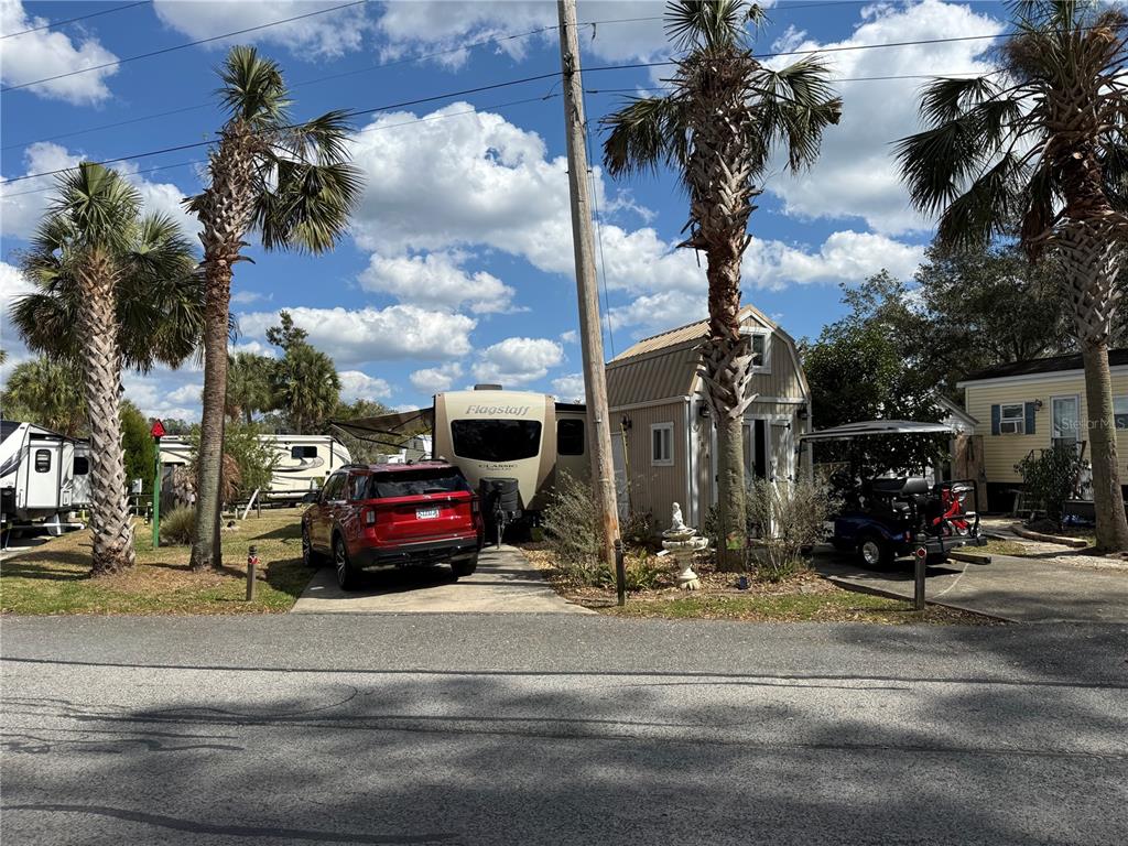 a view of street with parked cars