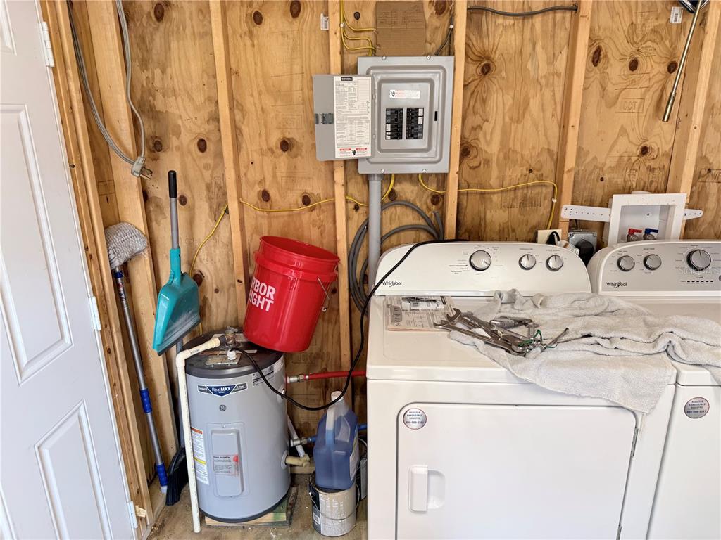 2875 Northeast 102nd Ave Road Silver Springs, FL 34488 - Photo 13 of 68 a utility room with dryer and washer